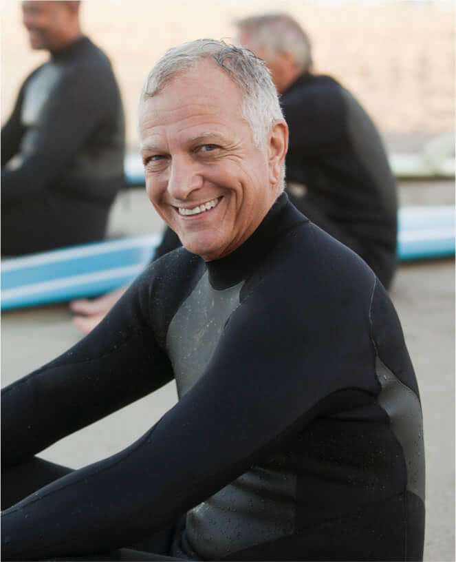 An older gentleman in a wetsuit.